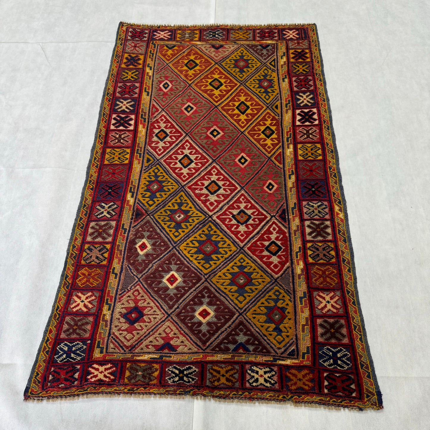 Handmade Afghan Wool Rug - 2.5ft x 5ft | Vibrant Red, Yellow, and Blue Geometric Carpet