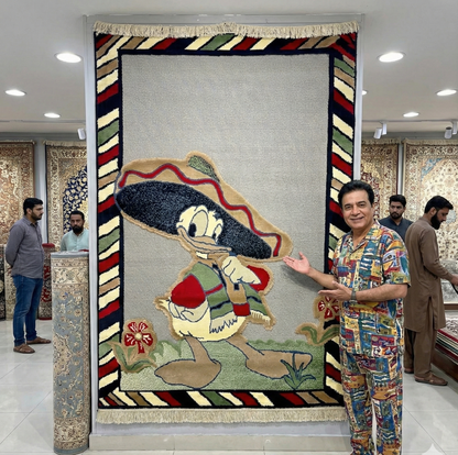 Man standing next to a large decorative rug with cartoon character design in a store setting.